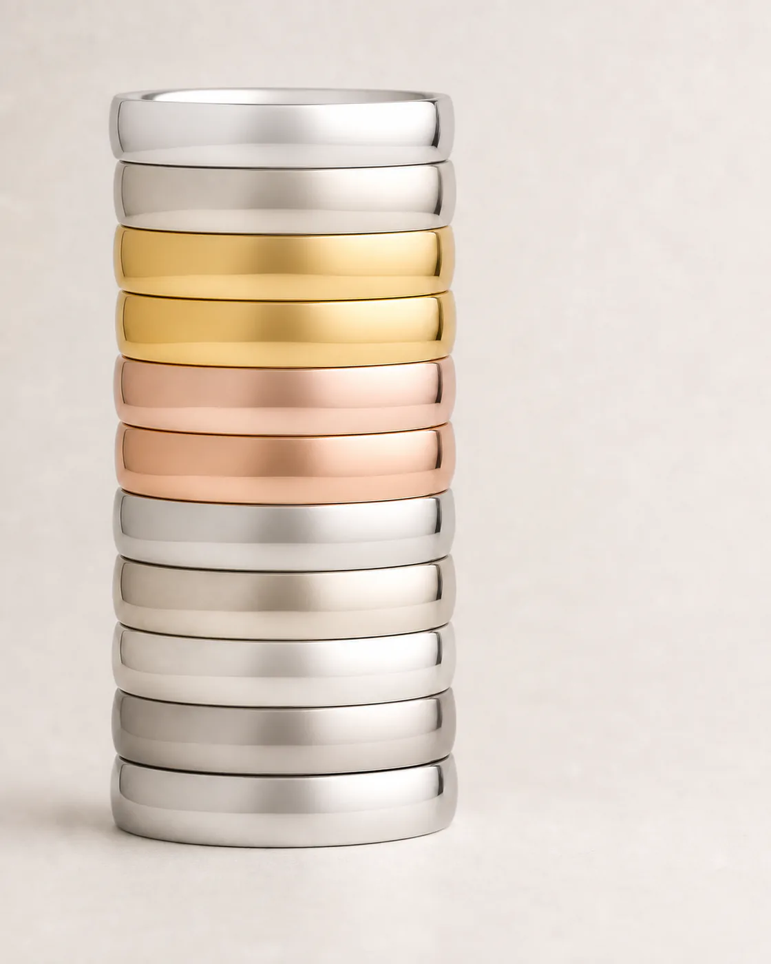 Polished bands showing silver, yellow-gold, rose-gold, and white-metal tones